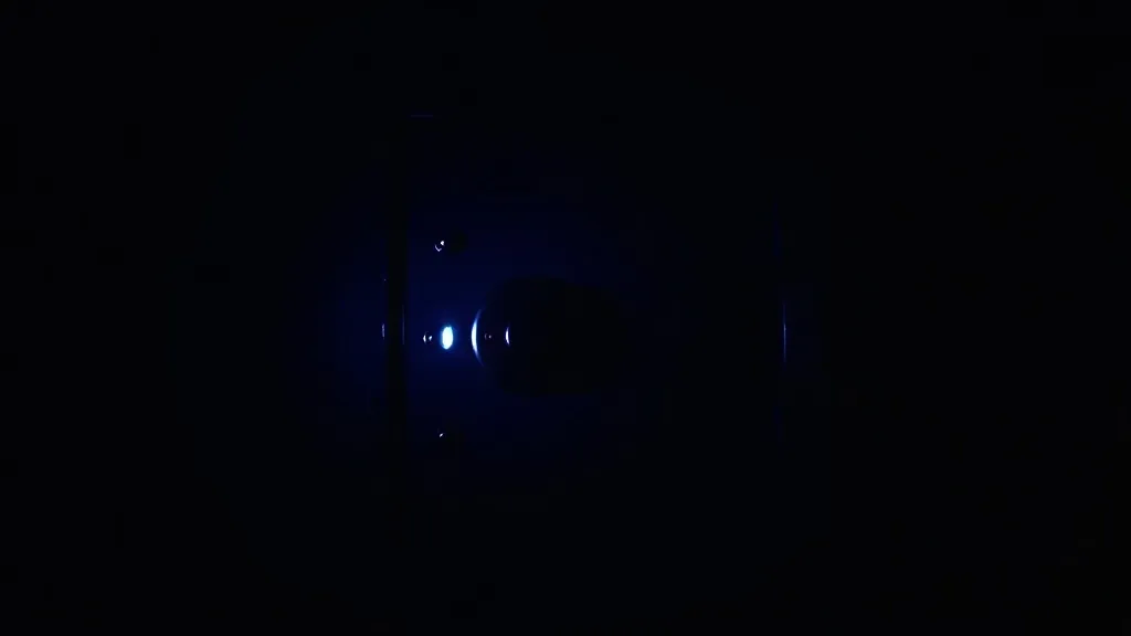 Safe box in a dark room with a single blue light reflecting